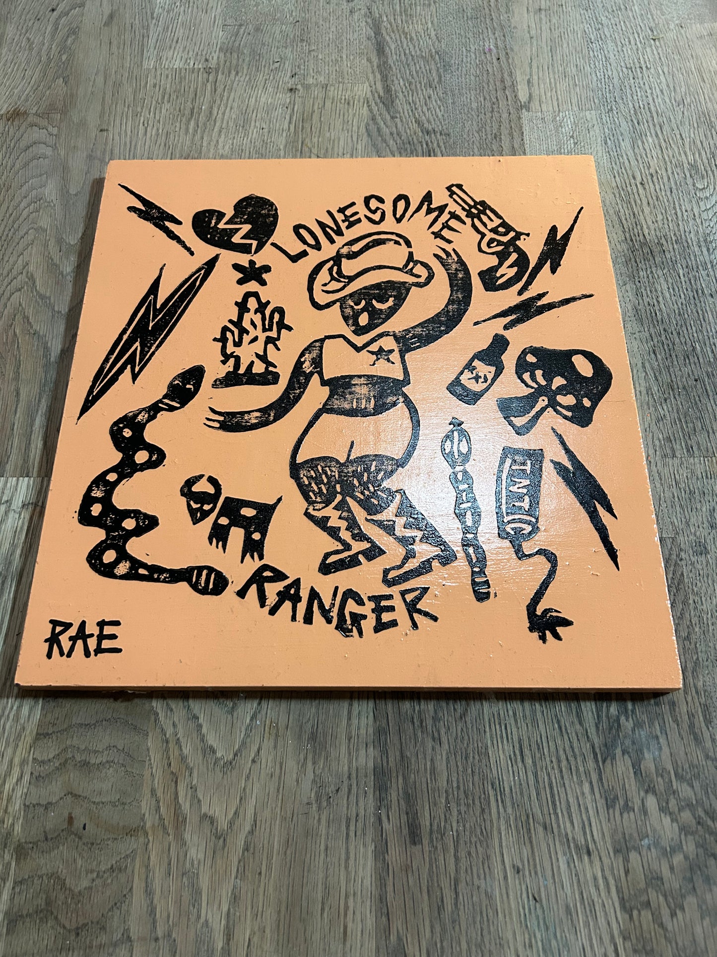 Lonesome Ranger varnished lino print on wood block